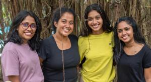 four women posing for a picture in front of a tree at Sisiliyana Stone Resort in Gonapola