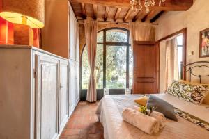 Ένα ή περισσότερα κρεβάτια σε δωμάτιο στο Charming House in Monte San Savino, Private Pool +41 φωτογραφίες