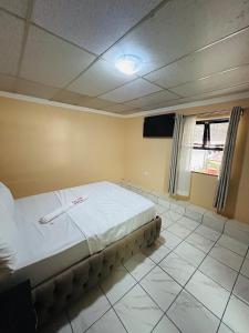 a bedroom with a bed in a room at CAVO LODGE Maboneng in Johannesburg