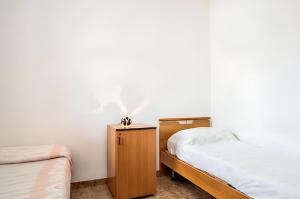 A bed or beds in a room at Cozy House, Santa Maria del Focallo, Fireplace
