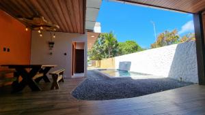 Casa de Praia com Piscina em Maceió - Ipioca - Sauaçuhy的庭院或其他户外区域