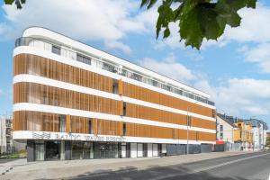 a building on the side of a street at Your Holidays Baltic Waves B309 in Międzyzdroje