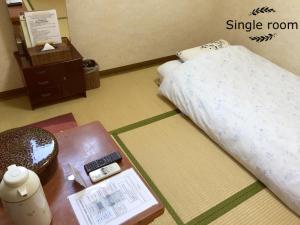 Postel nebo postele na pokoji v ubytování Asakusa Ryokan Toukaisou