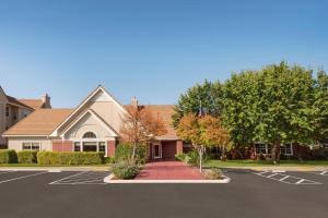 a house with a parking lot in front of it at Residence Inn San Jose South/Morgan Hill in Morgan Hill