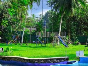 a park with a playground with a slide at Sisiliyana Stone Resort in Gonapola