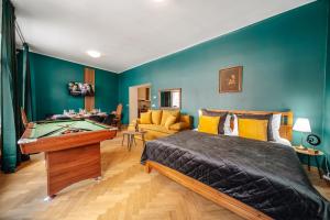 a bedroom with a bed and a pool table at Wagnerstays Royal Billiard Residence in Prague