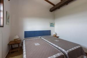 a bedroom with a large bed in a room at La Renardière Provence in Mollans-sur-Ouvèze