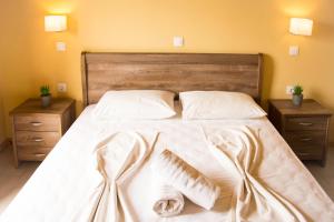 Postel nebo postele na pokoji v ubytování Koulouris Beach Hotel
