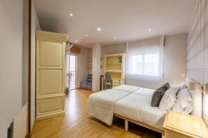Postel nebo postele na pokoji v ubytování Apartamento turístico 3 habitaciones a 140m playa Caneliñas Portonovo 101