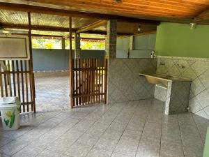 a room with a table and a counter in a building at Casa Vista Pedra Azul in Domingos Martins +12 photos
