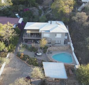 an aerial view of a house with a swimming pool at Bryan's View in Windhoek