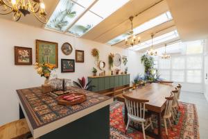 a dining room with a table and chairs at Summer Eternal Pool Villa Nimman in Chiang Mai
