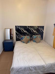 Postel nebo postele na pokoji v ubytování unique Appartement in Agadir