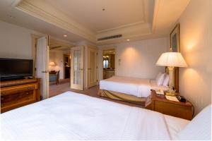 Cama ou camas em um quarto em Rihga Royal Hotel Tokyo