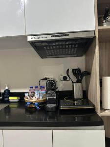 Kuchyň nebo kuchyňský kout v ubytování Cozy studio unit