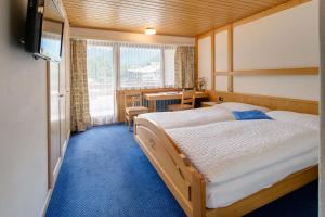 Postel nebo postele na pokoji v ubytování Hotel Parnass