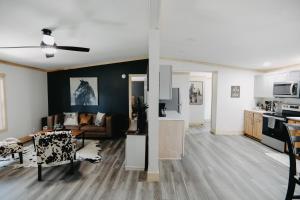 a living room and kitchen with a couch and a table at The Ranch in Elizabethtown