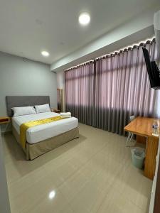 Postel nebo postele na pokoji v ubytování Bendezu Hotel
