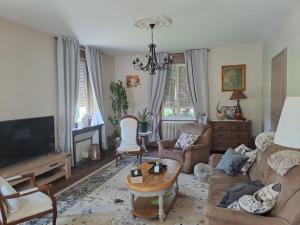 TV a/nebo společenská místnost v ubytování LA Maison DE CARO