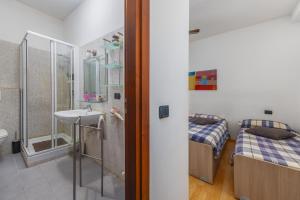 Letto o letti in una camera di TiglioExperienceComo