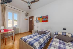 Letto o letti in una camera di TiglioExperienceComo