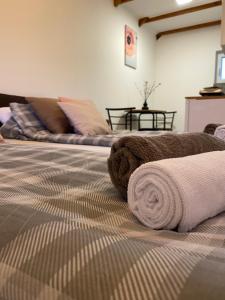 a stuffed animal laying on top of a bed at Altiora in Subotica