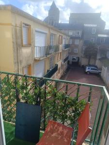 a balcony with a view of a parking lot at appartement, résidence centre ville, Le Tréport in Le Tréport