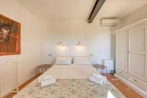 Postel nebo postele na pokoji v ubytování Tenuta Palmira agriturismo