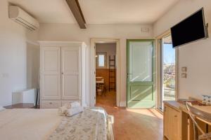 Postel nebo postele na pokoji v ubytování Tenuta Palmira agriturismo