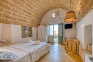 Postel nebo postele na pokoji v ubytování Tenuta Palmira agriturismo + 34 fotografií