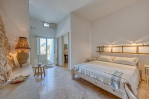 Postel nebo postele na pokoji v ubytování Tenuta Palmira agriturismo