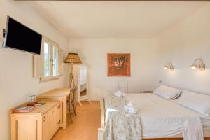 Postel nebo postele na pokoji v ubytování Tenuta Palmira agriturismo