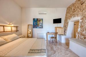 Postel nebo postele na pokoji v ubytování Tenuta Palmira agriturismo