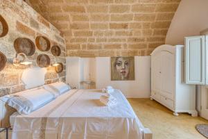 Postel nebo postele na pokoji v ubytování Tenuta Palmira agriturismo
