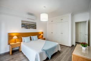 Postel nebo postele na pokoji v ubytování VilaRosa BeachPearl by CC 202 + 40 fotografií