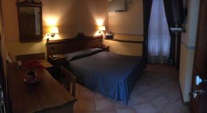 Letto o letti in una camera di Hotel Il Barocco