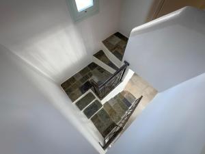 a view of a staircase in a house at ANETON Residences in Karavostasi
