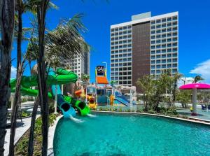 a pool at a resort with a water park at Hotel Resort em Salinópolis in Salinópolis
