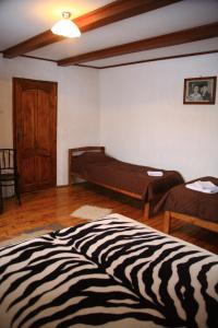 Katil atau katil-katil dalam bilik di Cabana Bunicilor