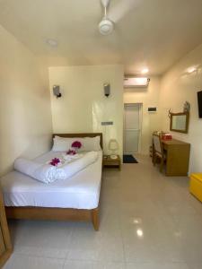 Postel nebo postele na pokoji v ubytování Maavaharu Guest House Himmafushi + 37 fotografií