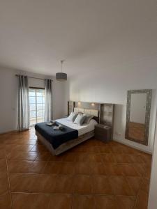 Postel nebo postele na pokoji v ubytování Casa Vila Sul AE