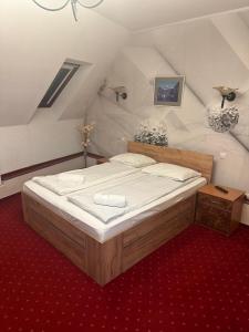 Postel nebo postele na pokoji v ubytování Hotel Rubin***