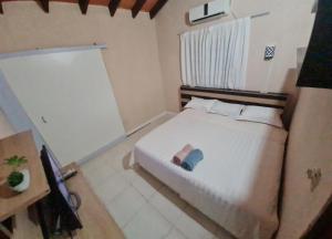 Postel nebo postele na pokoji v ubytování La casa de Aldo y Paty