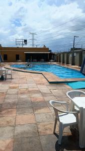 a swimming pool on top of a building at COP30 Mobiliado Apt Belém in Belém