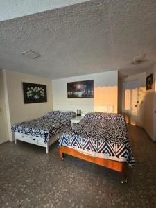 Un ou plusieurs lits dans un hébergement de l'établissement Departamento vista al mar y acceso a playa en bahía de Acapulco - Torres Gemelas