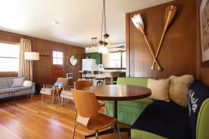 a living room with a table and a dining room at Gorgeous Views, Fishing at Private Cabin on Pelican Lake, Orr MN in Orr