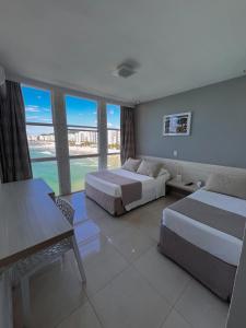 Uma área de estar em Grand Hotel Guarujá - A sua Melhor Experiência Beira Mar na Praia!