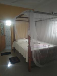 Ένα ή περισσότερα κρεβάτια σε δωμάτιο στο Danushka Family Guesthouse