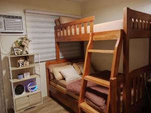 Postel nebo postele na pokoji v ubytování Condo in Silang Fullerton Suites - near tagaytay and nuvali