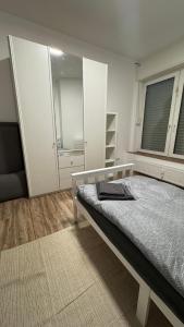 a bedroom with a bed and a large window at Ferienwohnung-Monteurwohnung ANTON bis zu 4 Personen in Kleve, zentrale Lage in Kleve +6 photos